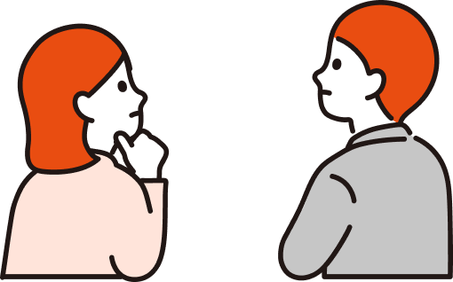 考えながら話す二人の社員