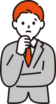 考え込むスーツ姿の社員
